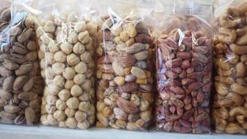 many mixed nuts in a plastic packet on shelf video