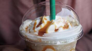 Enjoy a Delicious Caramel Frappe topped with Whipped Cream and a Fresh Strawberry Treat video