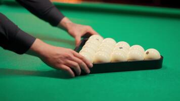A person placing white balls on a snooker table video