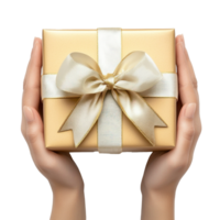 hands holding gift box with white and gold ribbon and bow isolate on transparent background png