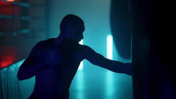 A man in a boxing ring with a red light video