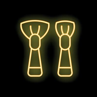 Pair of makeup brushes glowing with neon light effect