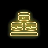 Yellow neon sign showing three macarons displayed on a countertop vector