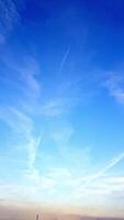 Skyscape where the horizon embraces a tapestry of soft, billowing clouds all painted in vibrant hues video