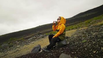 Relax Time After Climbing In Mountains, Woman Backpacker Sitting On Slope And Enjoying Hot Tea video