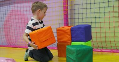 Child Stacking Colorful Foam Blocks Indoors video