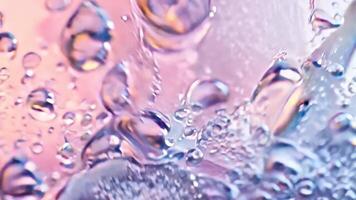 Soft pink and peach background with subtle water droplets and light gradient effects video