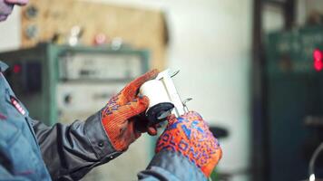 Technician measure part by vernier caliper. Close up of young male engineer taking precision measurement of metal parts with micrometer video