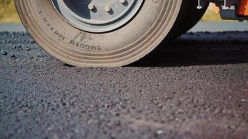 Asphalt spreader in work on site. Close up view of asphalt at the road under construction video