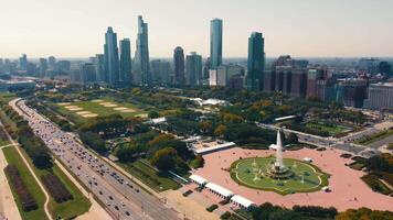 Aerial view of Chicago skyline and Grant Park. Aerial view of downtown Chicago skyline and Grant Park with the iconic Buckingham Fountain in the foreground on a sunny day. video