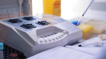 Technicians operating machine in laboratory video
