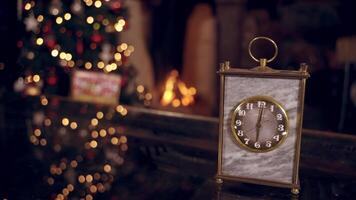 View of New Year clock. New Year clock before midnight on table against decorated room video