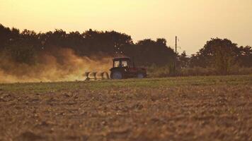 Tractor working on the farm. Tractor plowing fields, preparing land for sowing video
