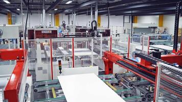 Industrial robot working in factor. Manufacturing of solar panels in factory video