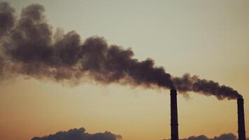 Smoking pipes making clouds. Multiple exposure of poor environment in cityscape pollution with heavy smoke from industrial chimneys video