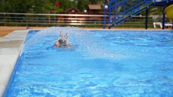 Surface of blue swimming pool. Swimming pool bottom ripple and flow waves background with fountain video