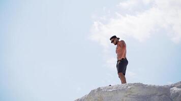 Man resting after training. Young man enjoying the nature during rest after training video