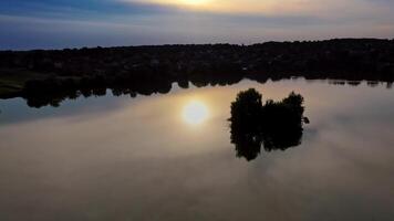 Reflection of sun in water. Aerial view of reflection of sunset in the water video