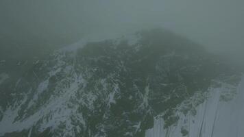 Snowy mountain range view from FPV drone video