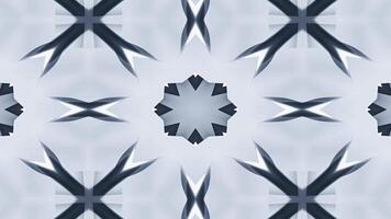 A symmetrical abstract design featuring star-like shapes in soft gray tones. video