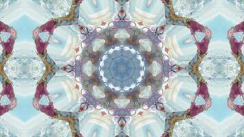 A symmetrical kaleidoscopic design featuring vibrant colors and intricate patterns. video