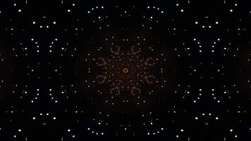 A symmetrical design featuring golden sparkles and star-like shapes against a dark background. video