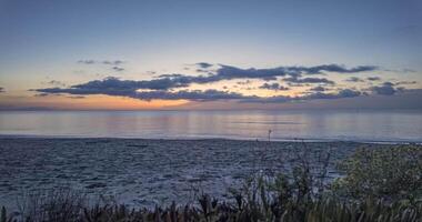 Time-lapse showing day-to-night transition at Poggio-Mezzana beach, Corsica, with stunning coastal views video