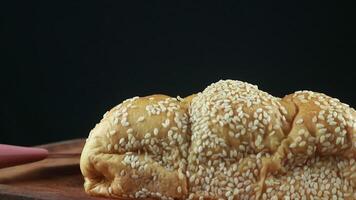 Homemade wheat bread with sesame seeds and cheese. Rotating display video