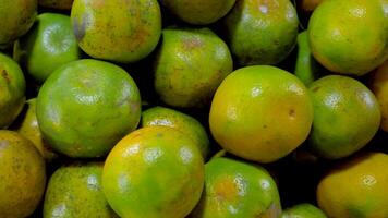pile of oranges in a large container its free videos
