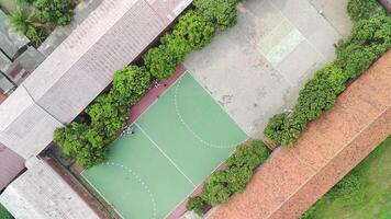 An aerial view of a soccer field and a house video