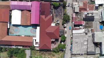 An aerial view of a school building with a pool video