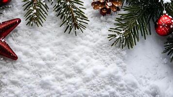 Festive christmas star and pinecones on snowy background with fir branches, celebrating merry christmas and happy new year video