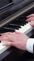 An Elegant Pianist Skillfully Playing Melodic Notes on a Digital Piano in a Beautiful Setting. Clip video
