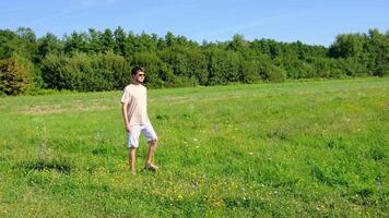 Man walking along a narrow path, surrounded by natural landscape, capturing a peaceful and contemplative atmosphere. Focus on simplicity, solitude, and connection with nature. video