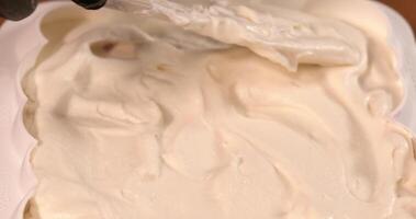 White cream is mixed in a container video