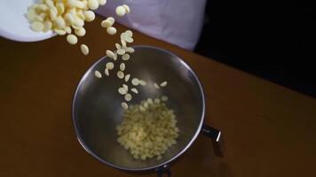 Chocolate is poured into the pot on the table video