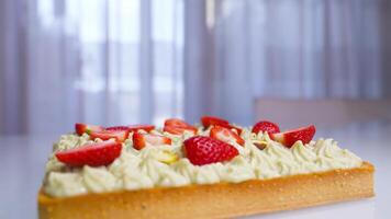 Tasty strawberries on top of the cake cream video