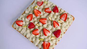 Square cake with cream and strawberries video