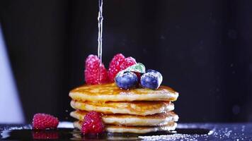 Syrup poured in slow motion on the pancake video
