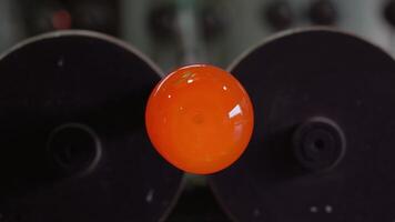 Hot blow glass rotates on the machinery video