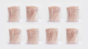 Toothpick containers rotate on white background video