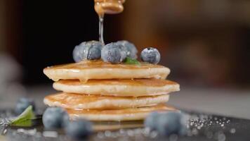 Syrup is put on top of pancakes video