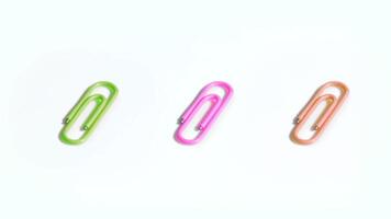 Colored clips for paper on the white background video