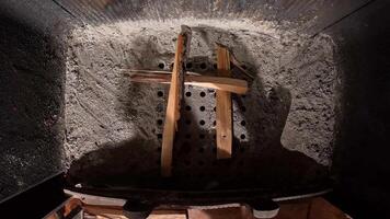 stacking firewood into a fireplace for kindling. preparing to light a fire. view from inside a fireplace. camera inside a chimney. view from above. kindling the fireplace. heating with a fireplace video