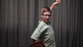 boy playing knight. little boy waving wooden sword. kid with shield and sword attacking enemy. child in the image of brave knight video