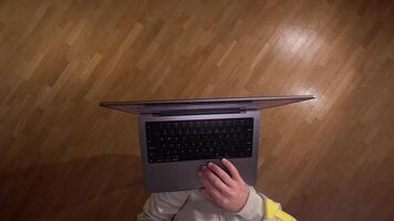 POV first person view Man standing holding laptop on hand and scrolling internet page, surfing internet. modern tech enables efficient communication, capturing digital nomad lifestyle video