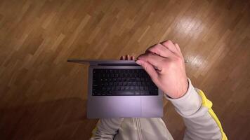 pov First person view Man opens laptop and starts working on computer. Starting work concept. Freelancer working from home on a laptop. modern tech enables efficient communication video