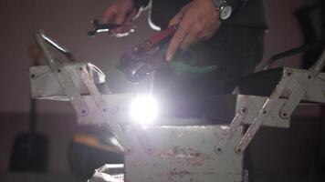 A person is using a torch to heat up a metal object video