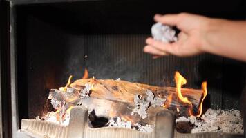 close up of man's hands crumpling documents, letters and throwing them into fire. Destruction of documents in fire. Destruction of evidence video