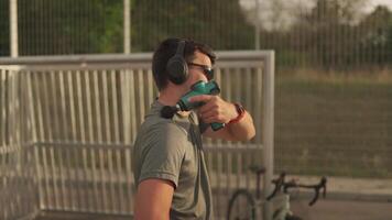 Cyclist use massage gun for deep percussive muscle massage. Hand massager for athletes, portable electric sports massager, hand massager for deep tissue. Muscle recovery and rehabilitation video